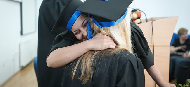 two happy students during a graduation